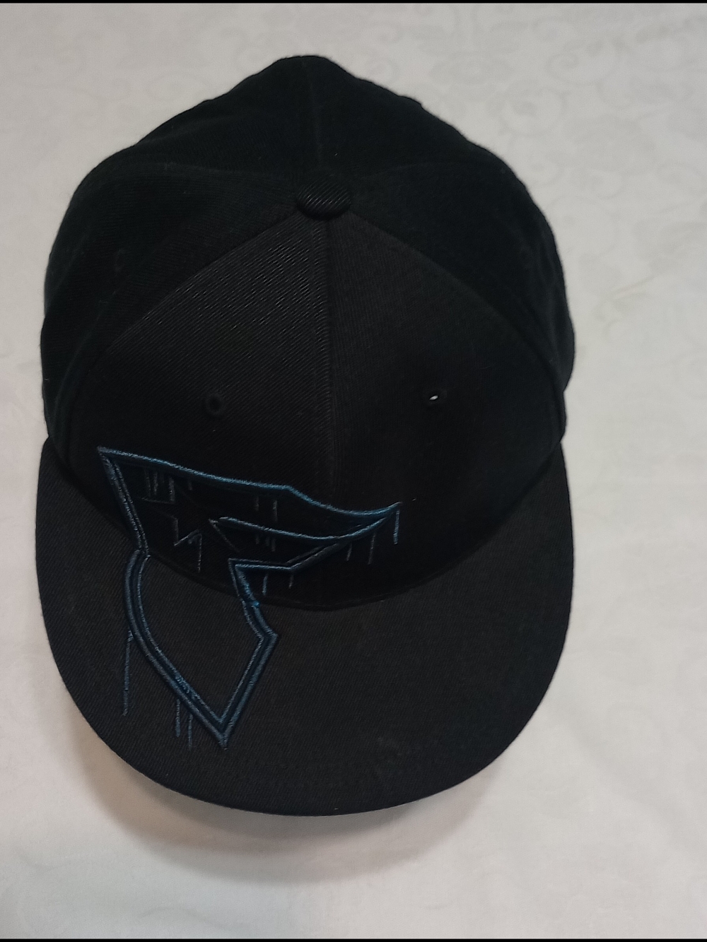 Black Snapback Cap with Blue Outline Graphic